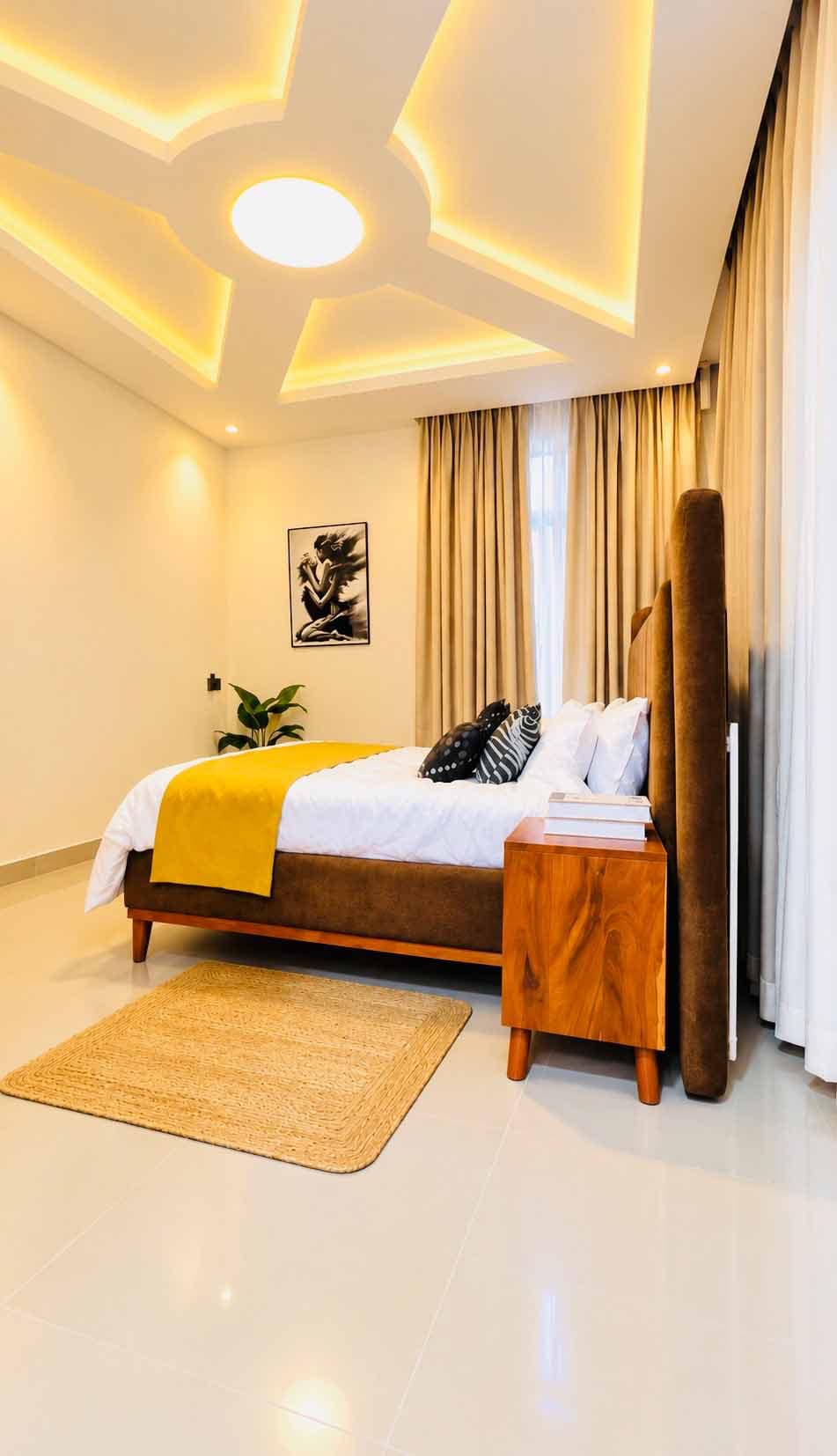 Master Bedroom Suite featuring an upholstered platform bed, vibrant yellow runner, and plush cushions.